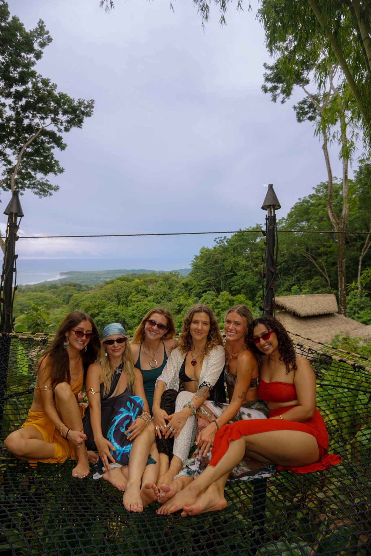 Six friends gathered on the nets with an ocean view