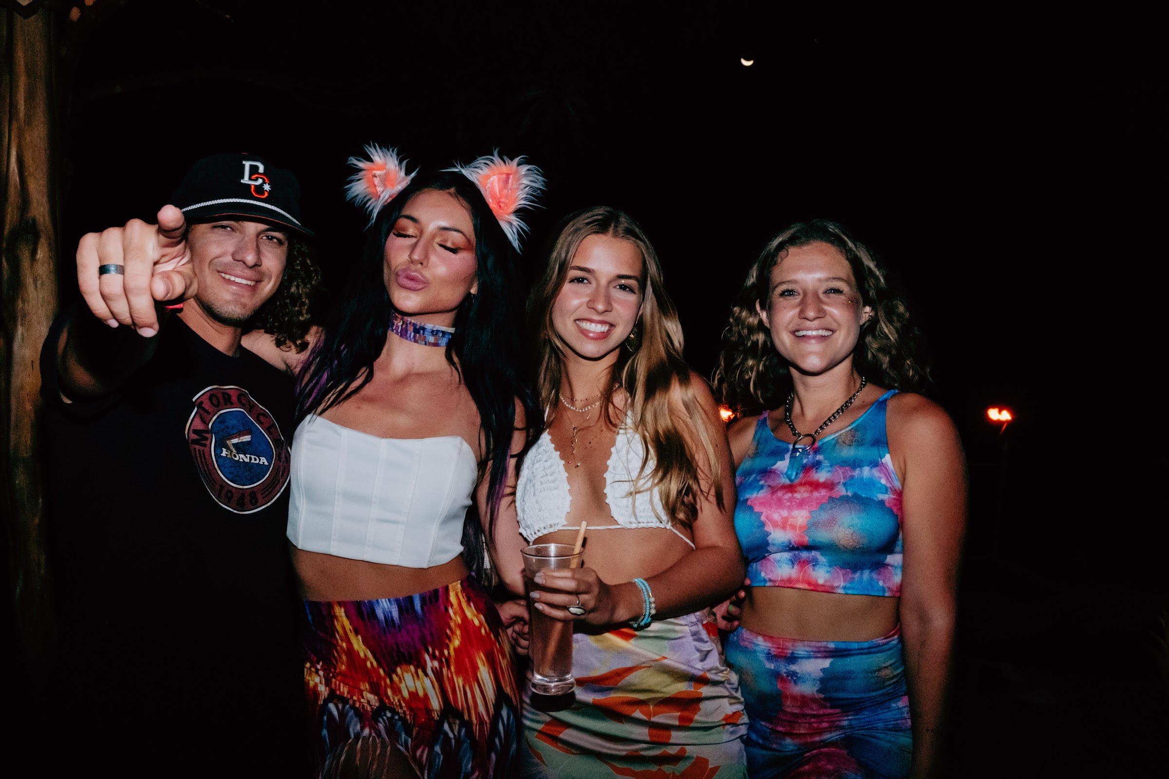 The crew together at the party, drinks up