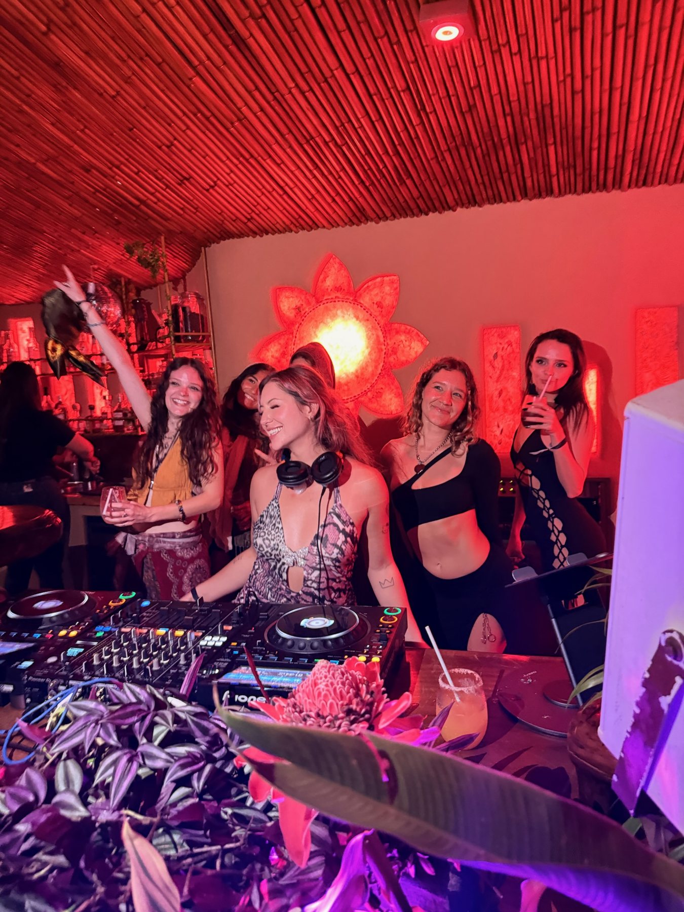 Packed dancefloor under deep red light