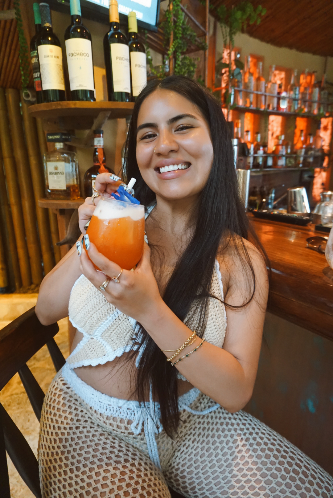 A guest enjoying a tropical cocktail at the jungle bar