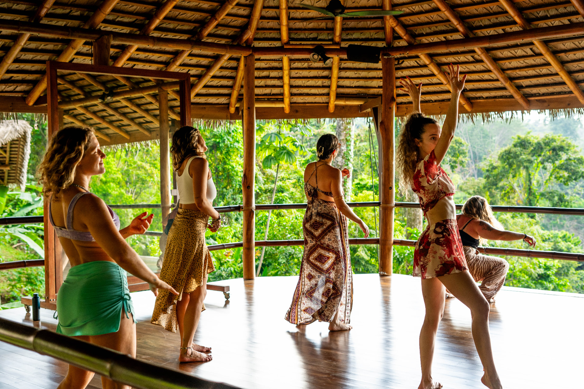 Movement journey in the open-air shala with the jungle behind