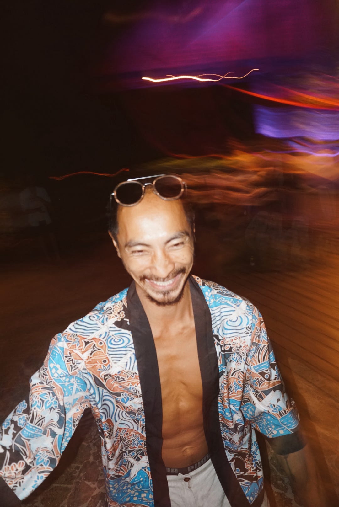 Laughing on the dancefloor under swirling lights