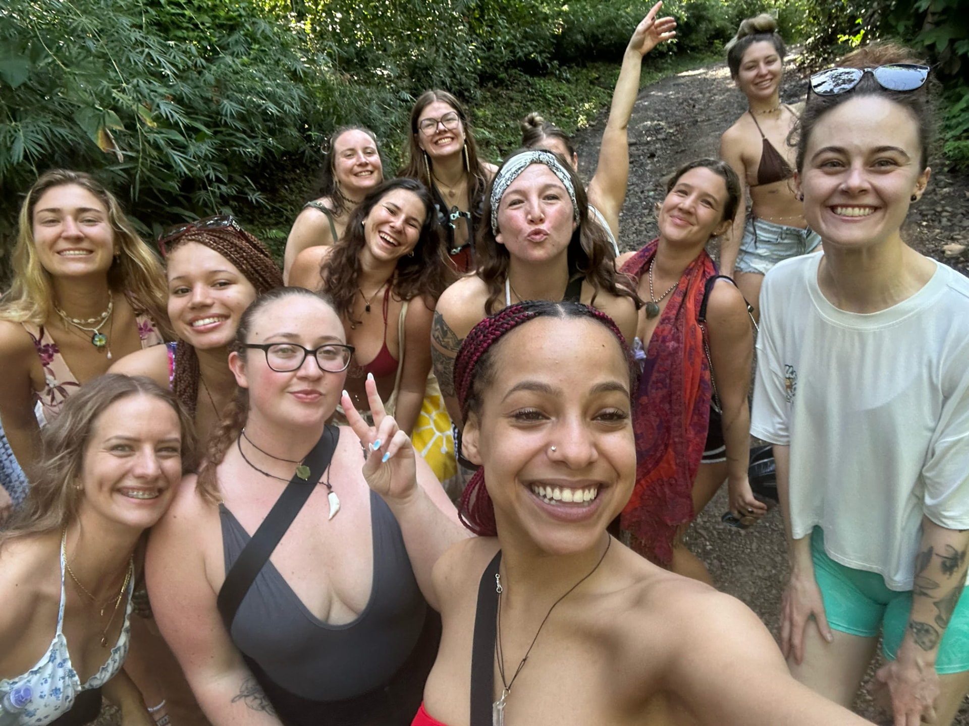 Big group selfie on the jungle path after a waterfall hike
