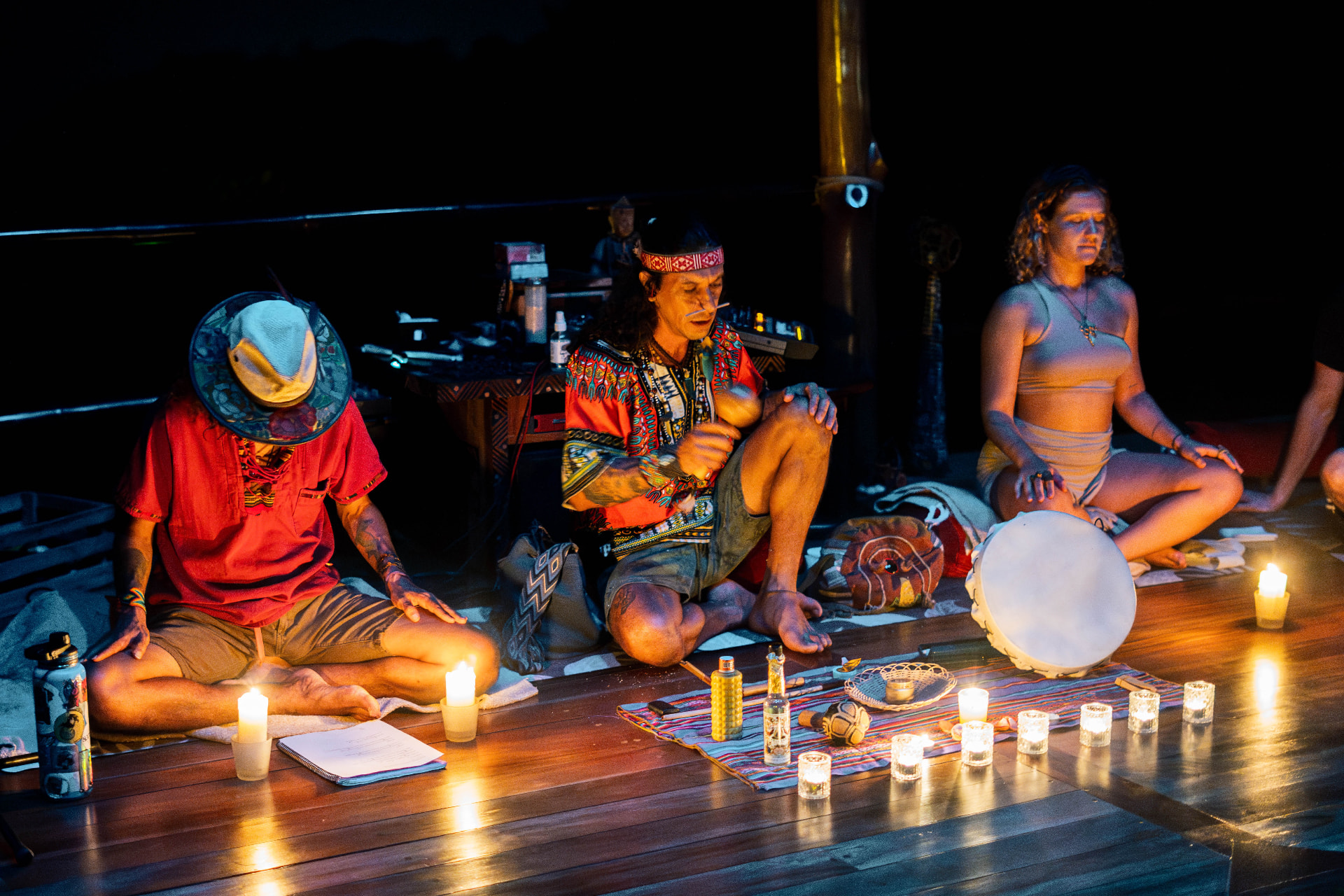 Drumming and medicine songs by candlelight in the shala