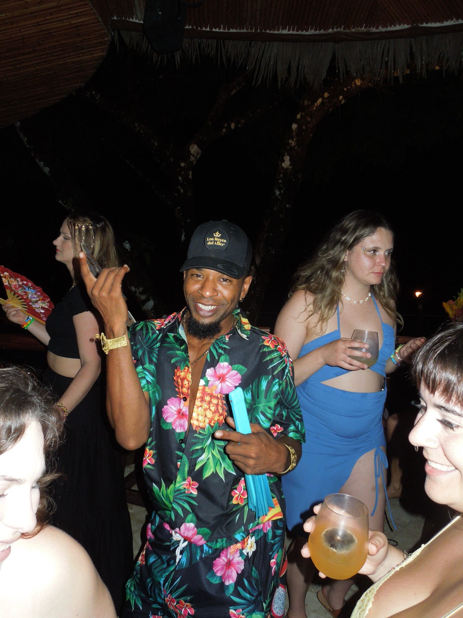 Crew hanging out on the dancefloor at the party