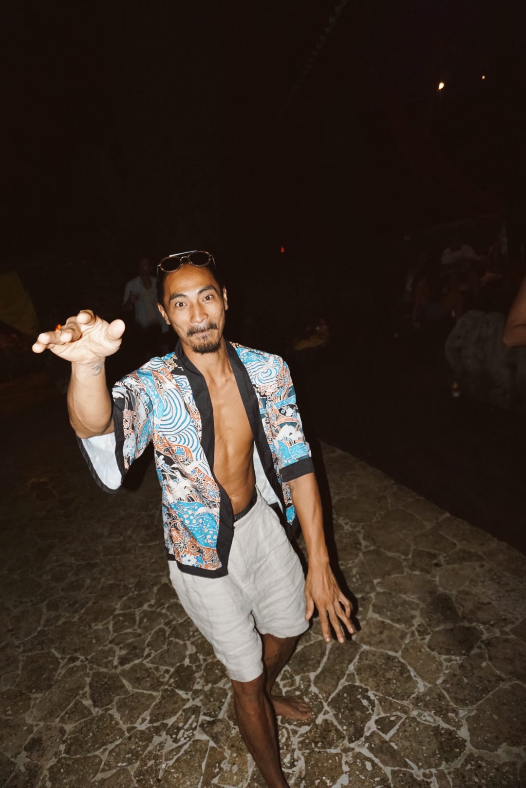 Striking a pose in a printed kimono at the night party