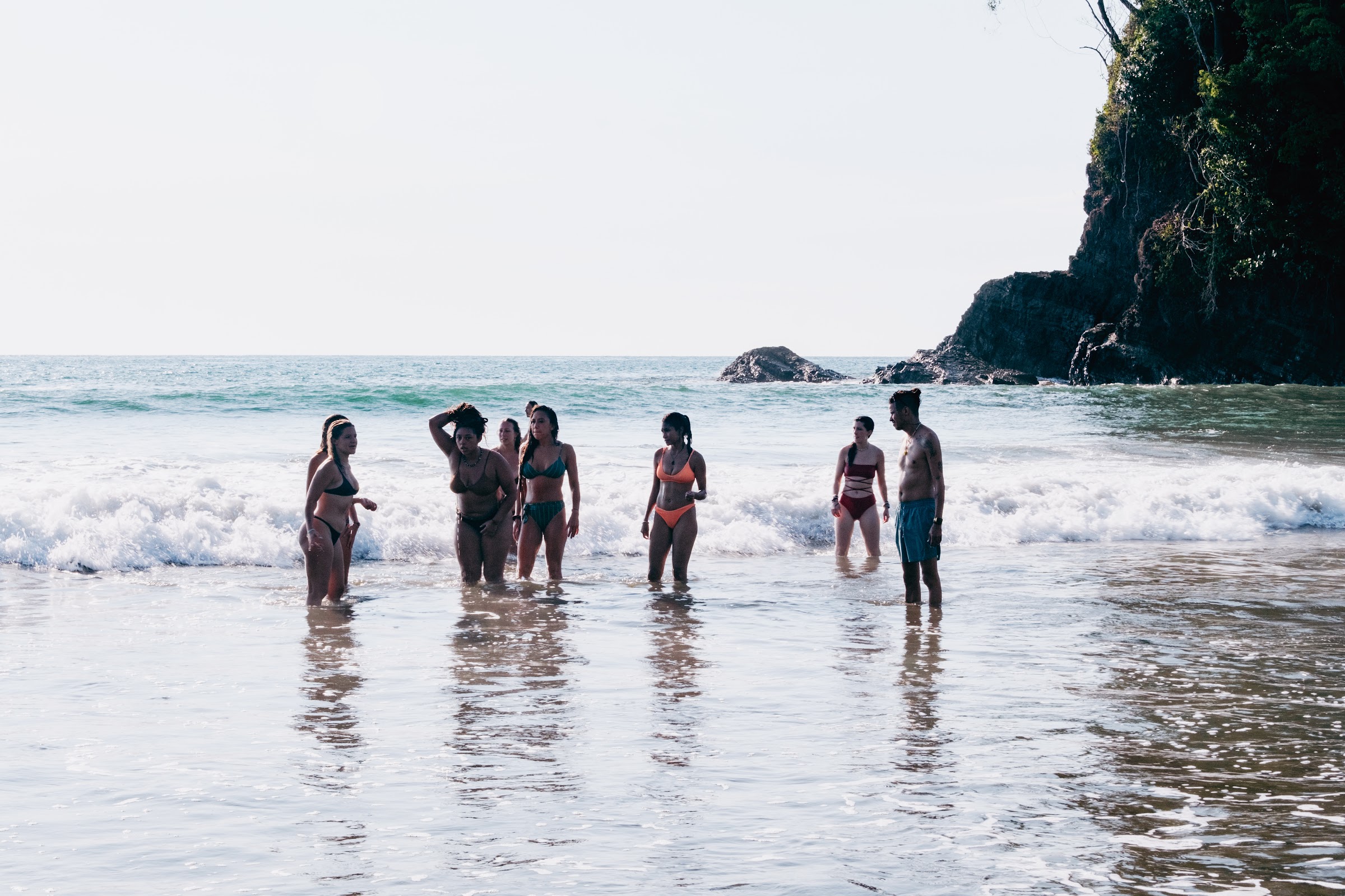 Wading into the ocean together at Uvita