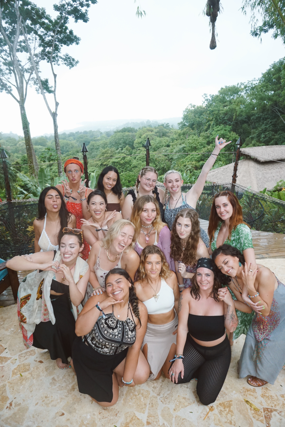 The retreat group gathered for a playful portrait above the jungle canopy