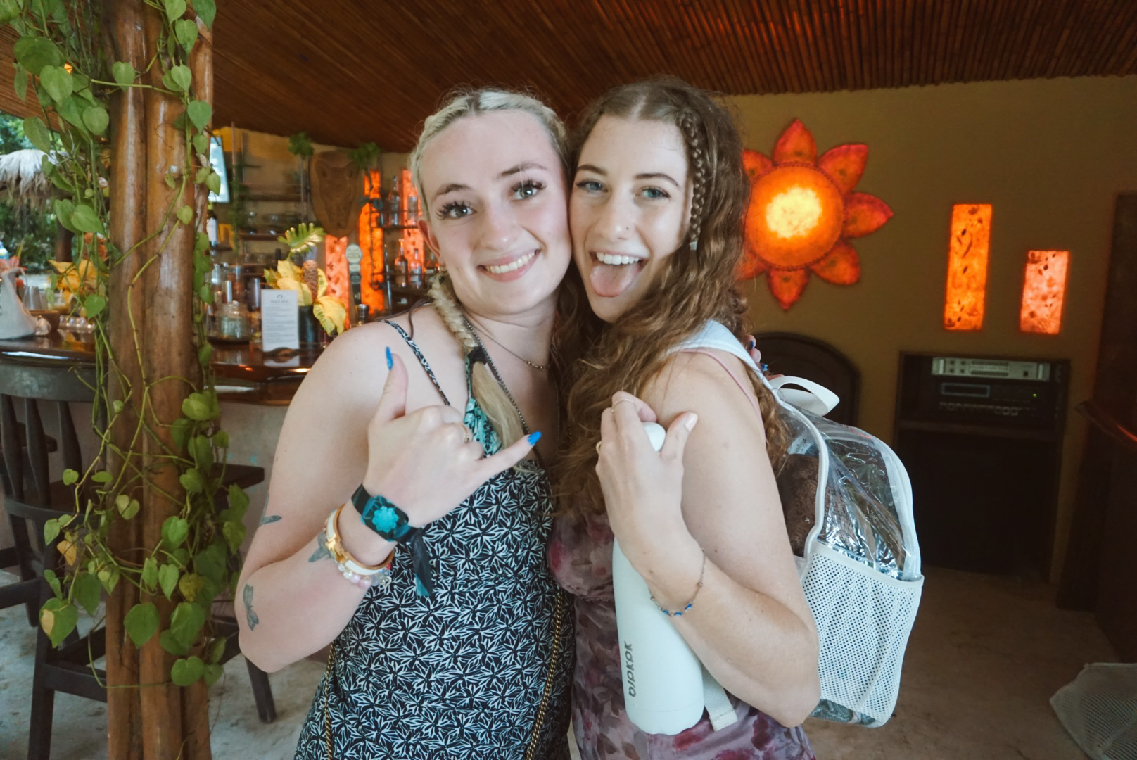 Two friends greeting each other at the Elixir Bar