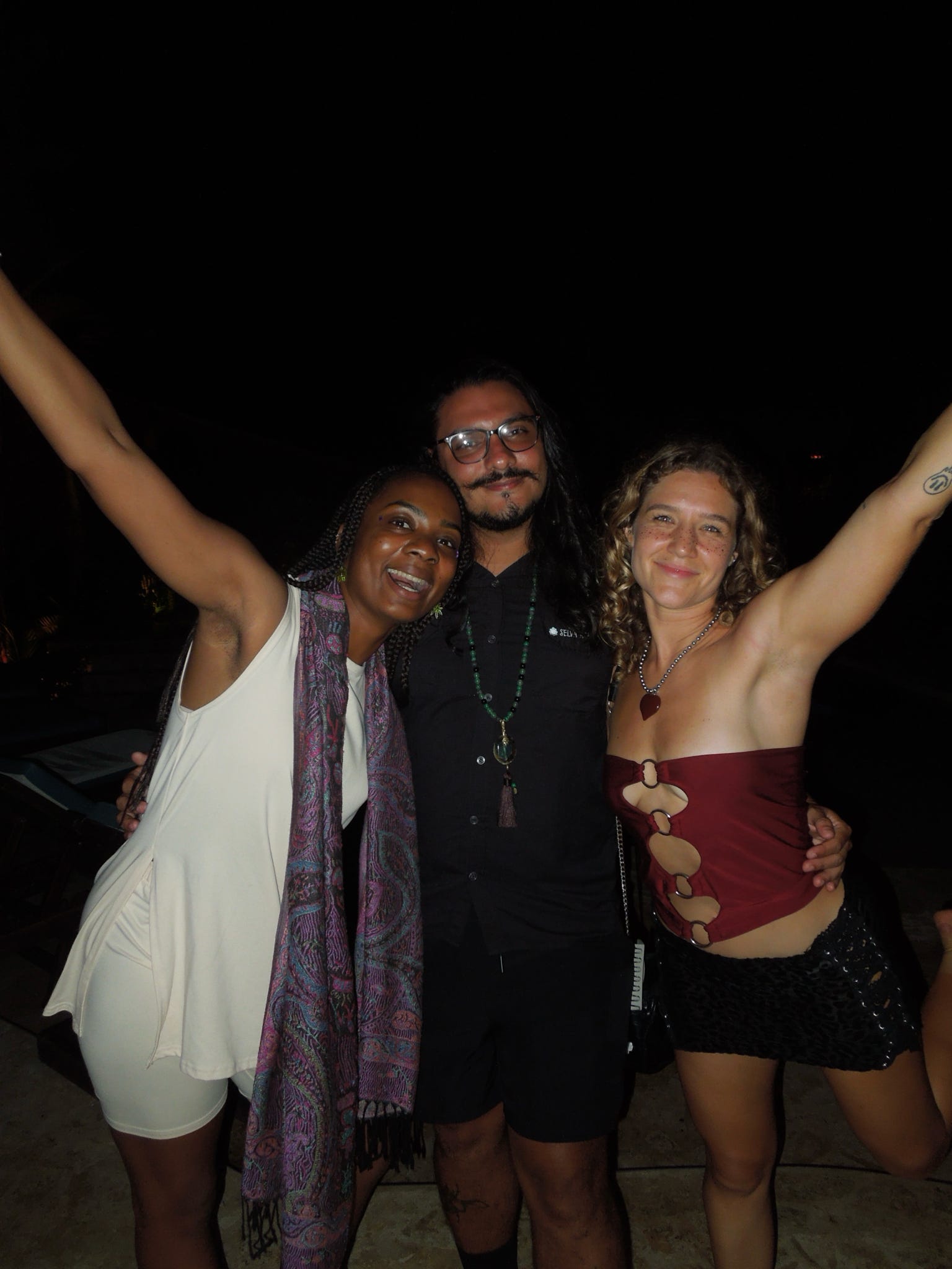 Friends posing together at the night party