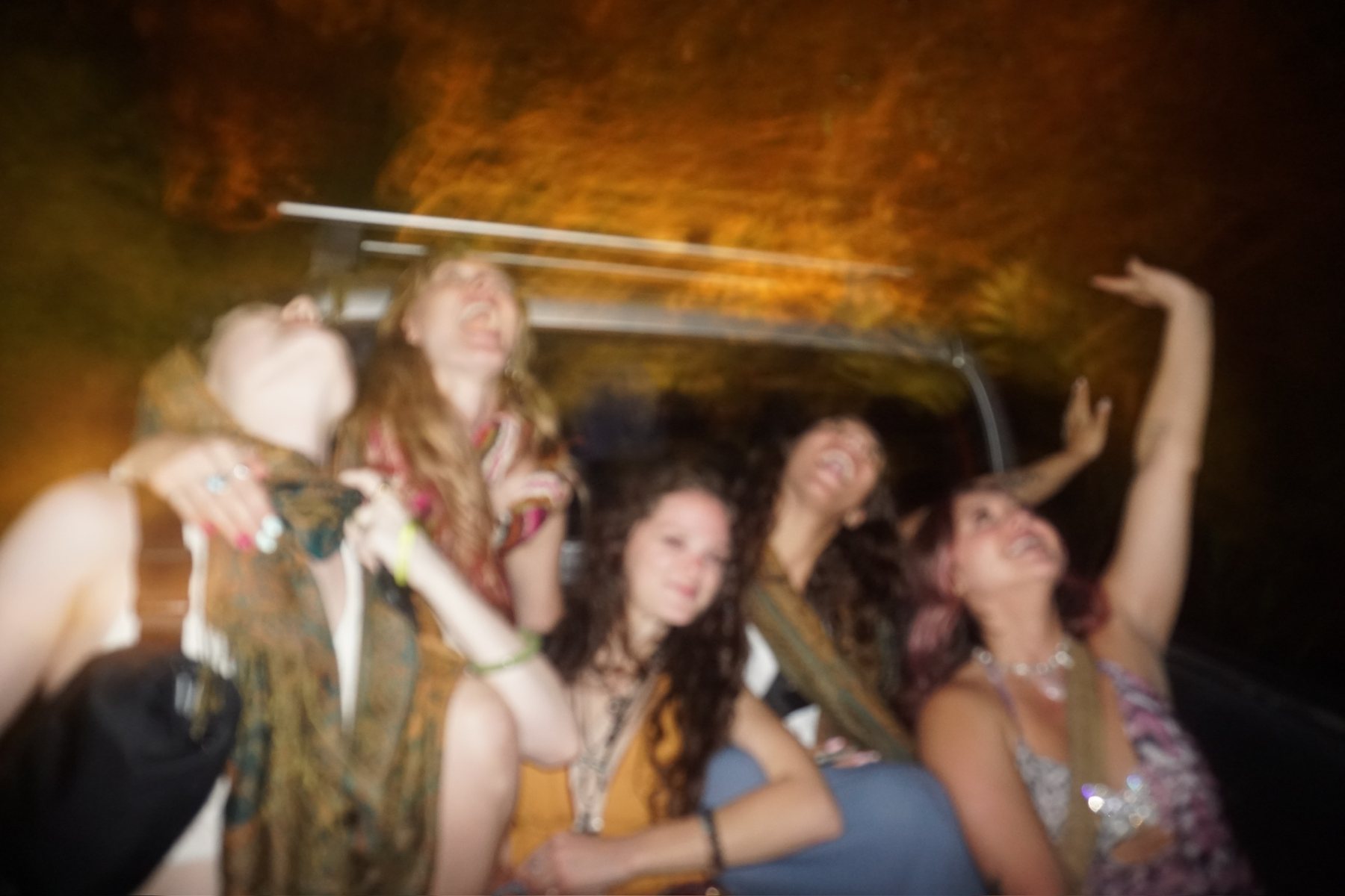 Back of the truck, arms up, driving through the jungle
