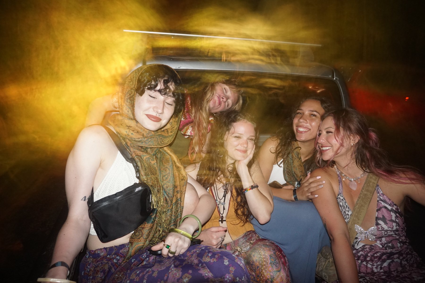 The crew piled into the back of a pickup truck, laughing
