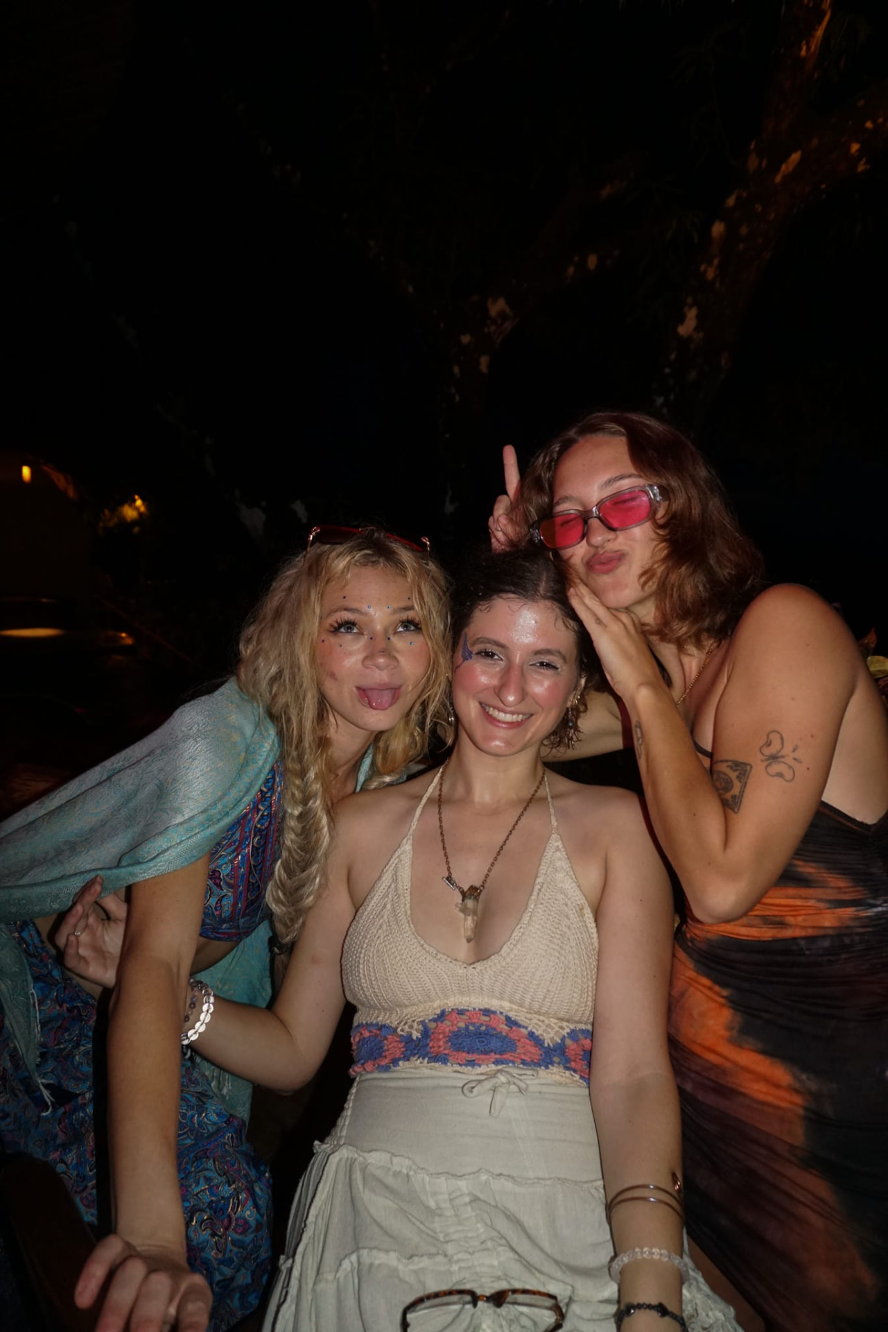 Three friends being silly at the night party