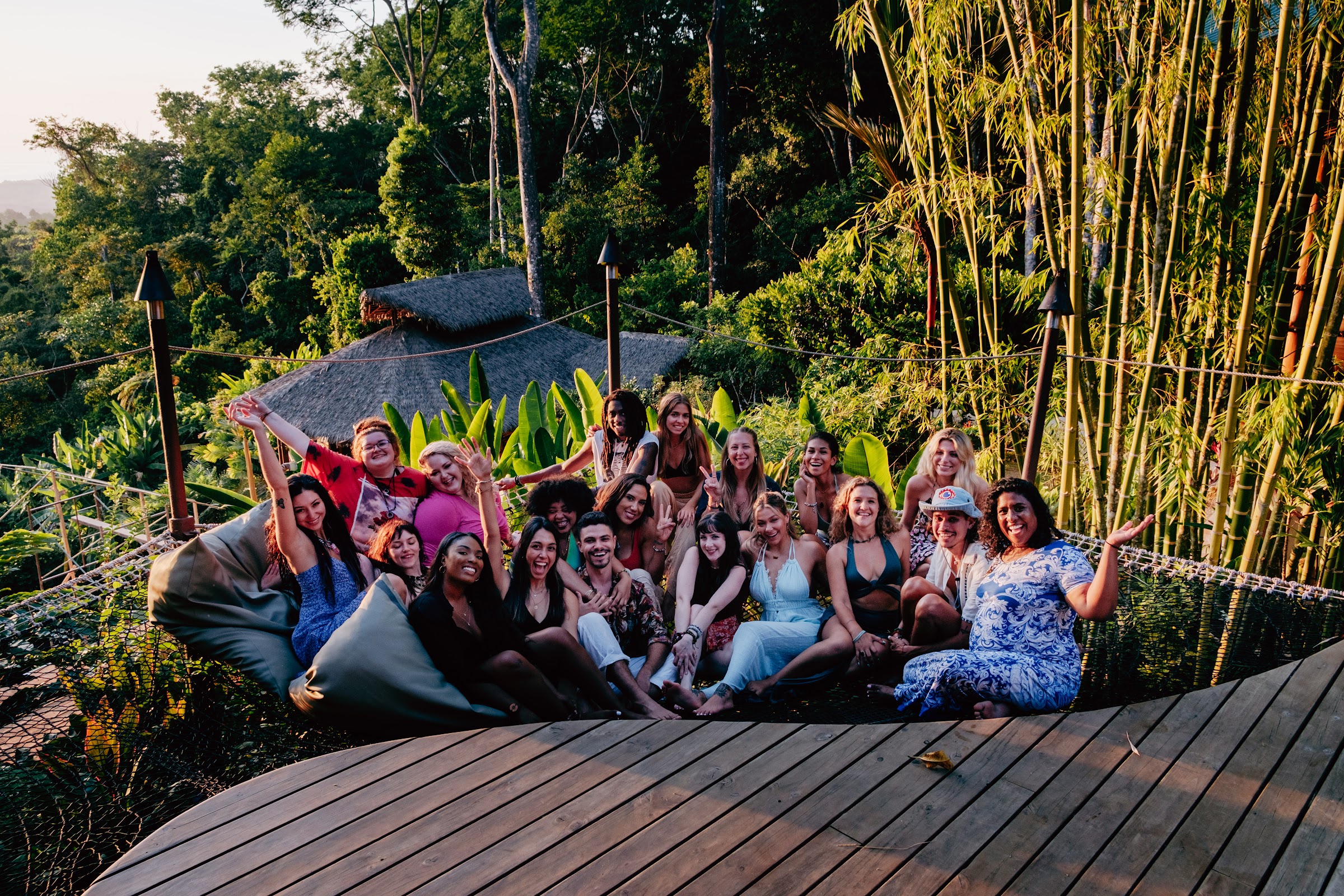 Big group photo on the bamboo deck before the party