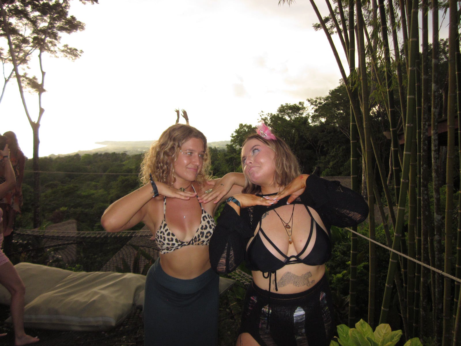 Two friends laughing together in the jungle