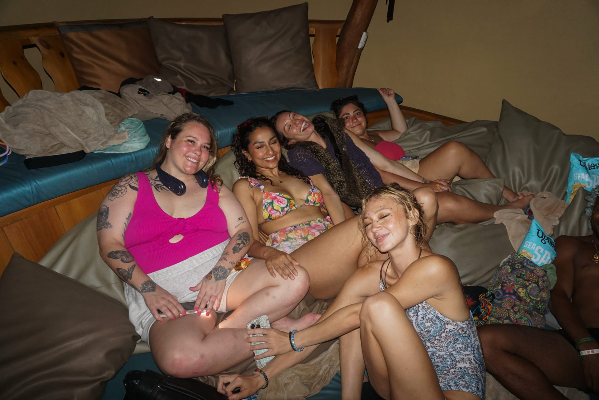Friends relaxing and smiling together in the lounge