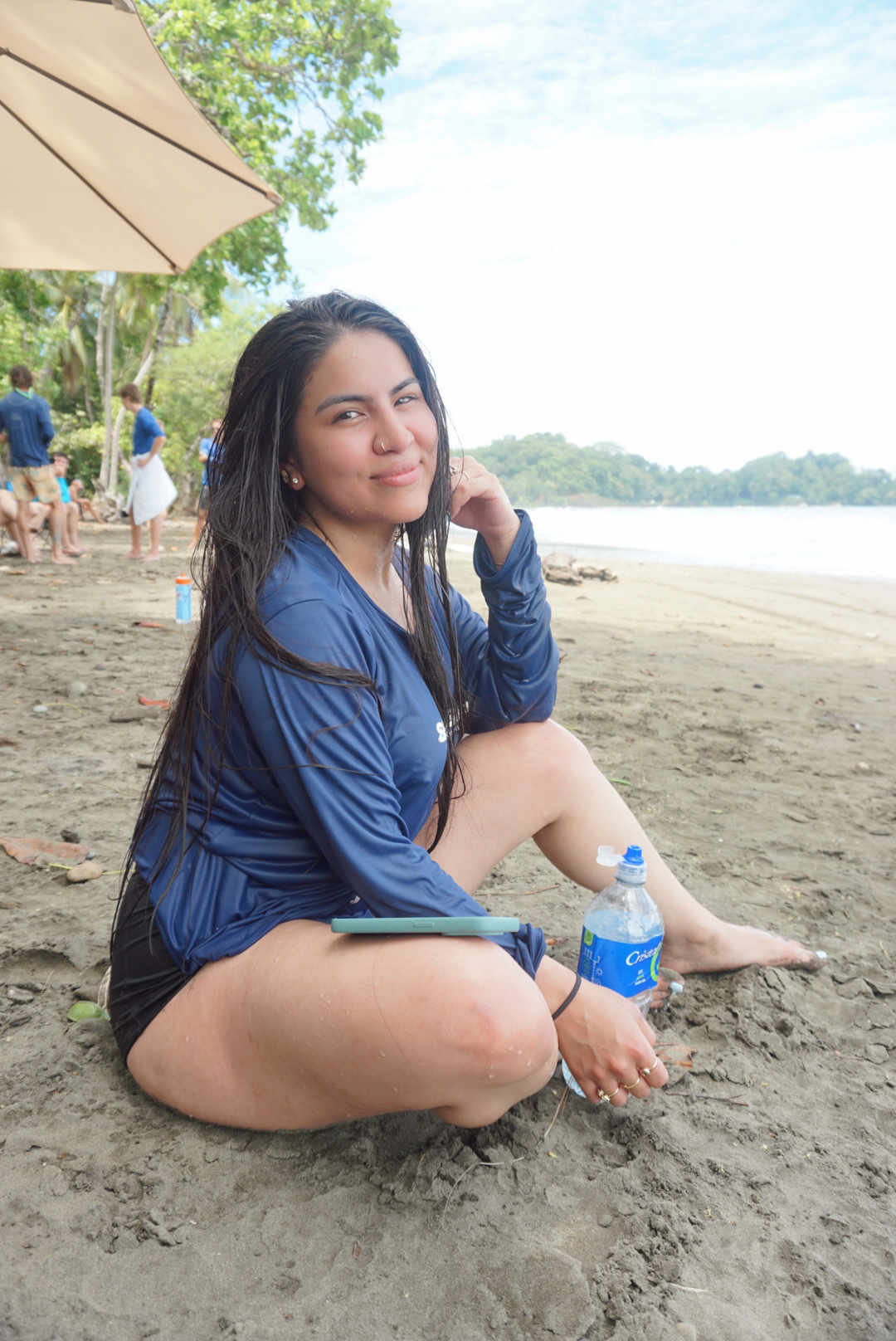 A guest relaxing on the beach after the water