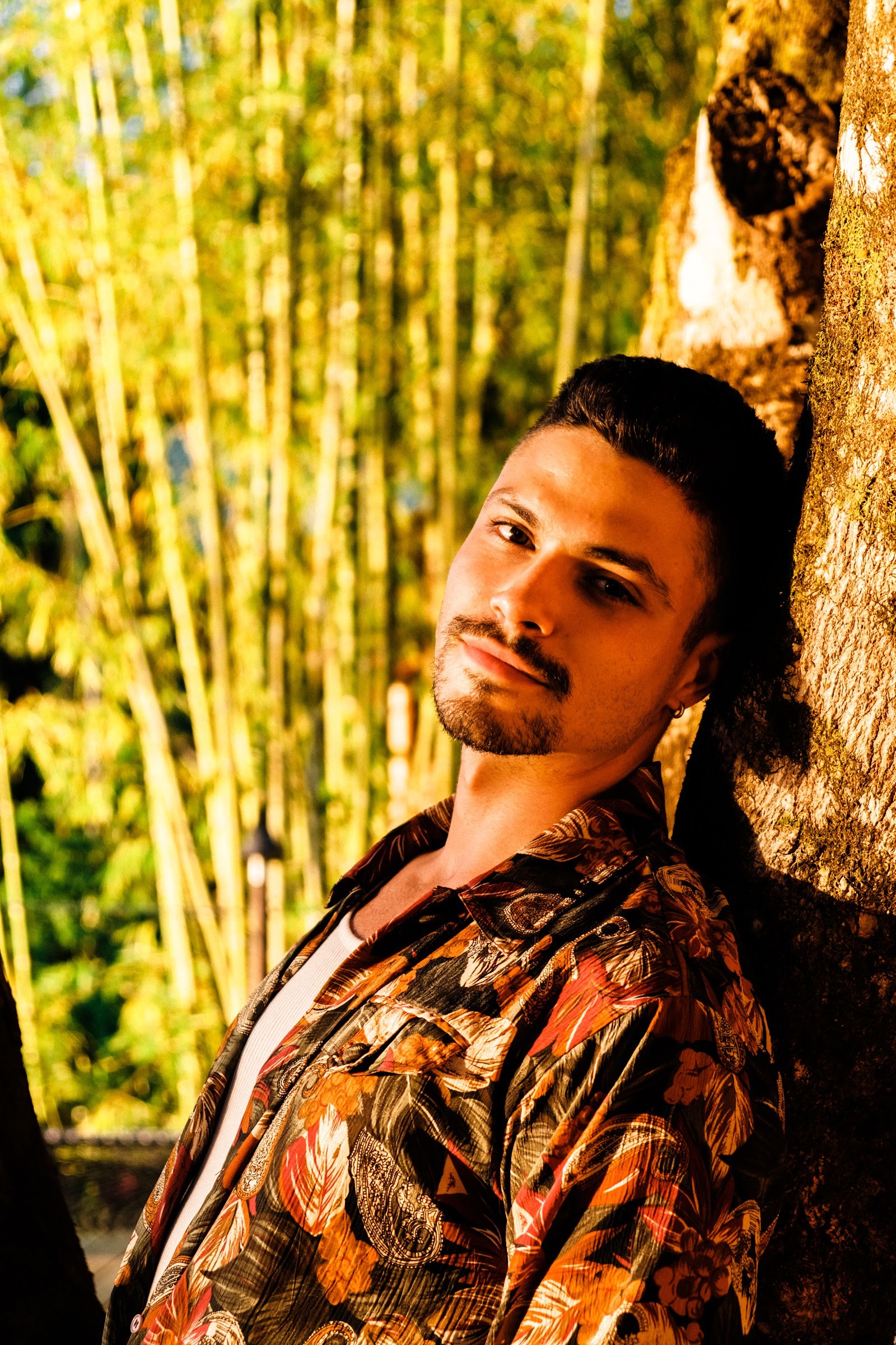 Portrait of a retreat guest in the bamboo grove at golden hour
