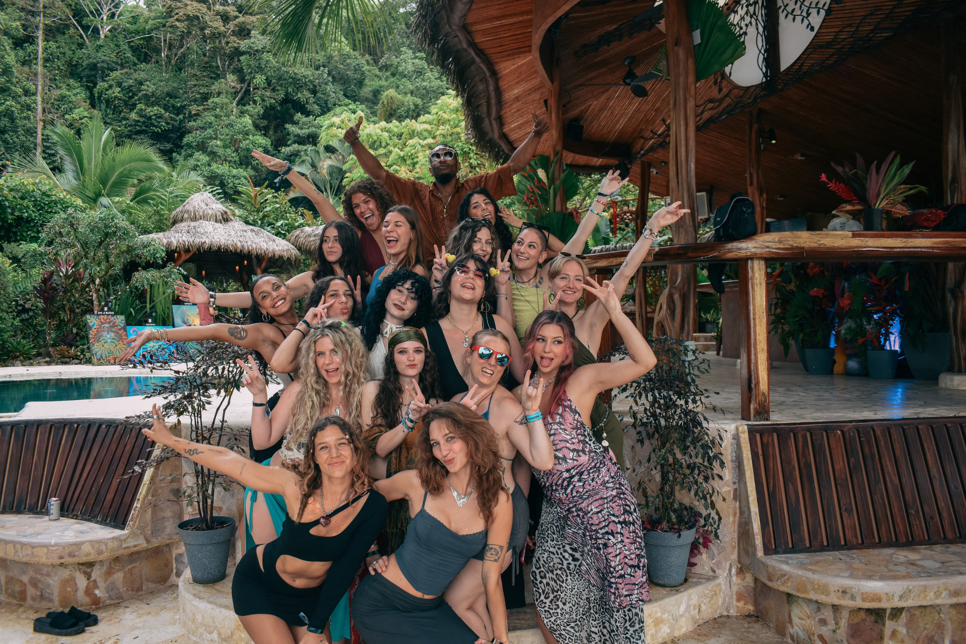 The retreat crew posing together by the pool at Selva Armonia