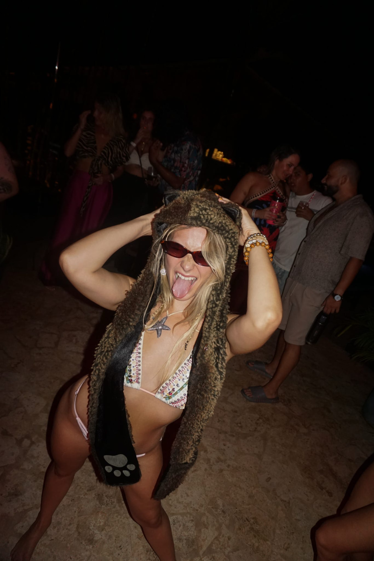 Dancing in a fur hat at the night party