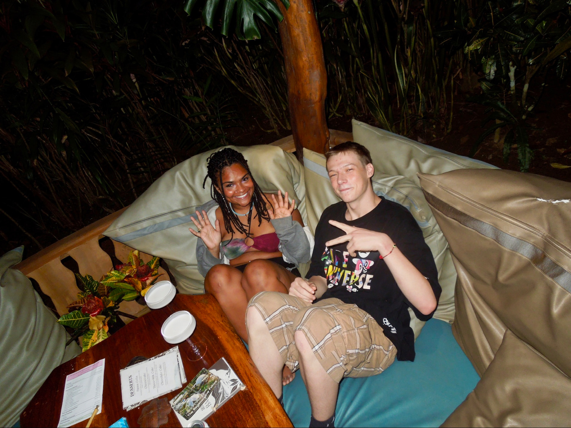 Two friends relaxing on a daybed at the retreat