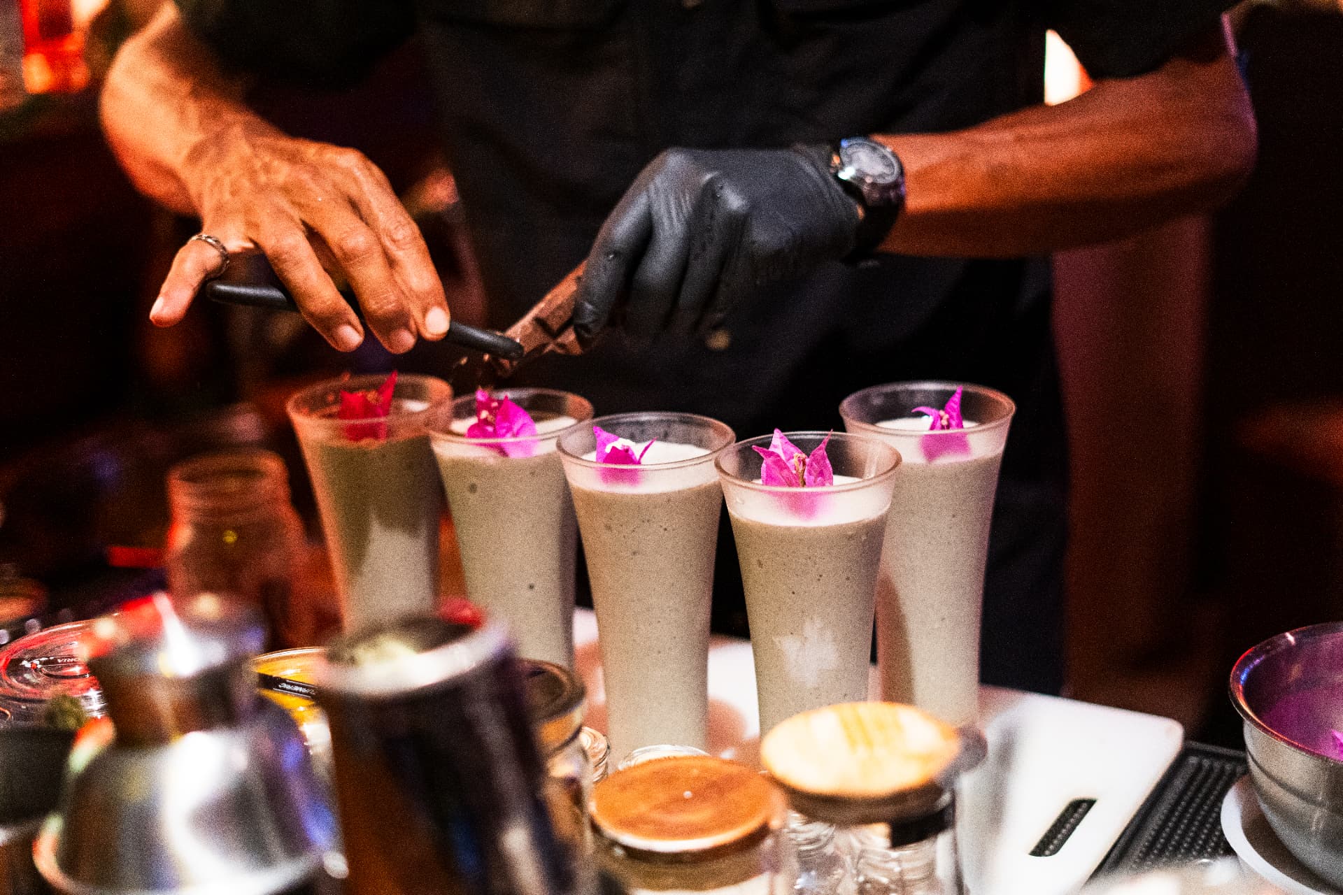 Cacao drinks garnished with bougainvillea at the bar