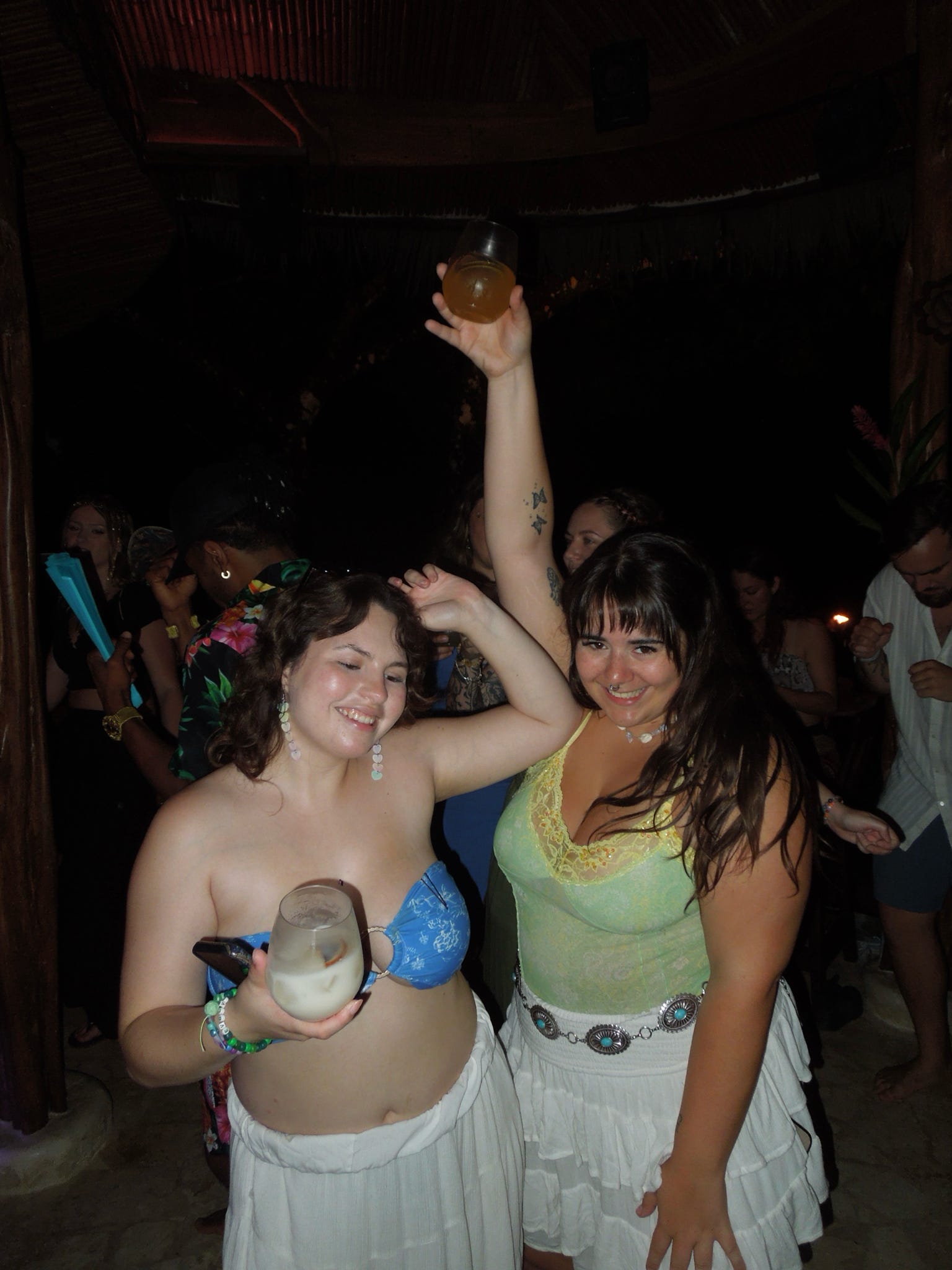 The crowd dancing under the palapa
