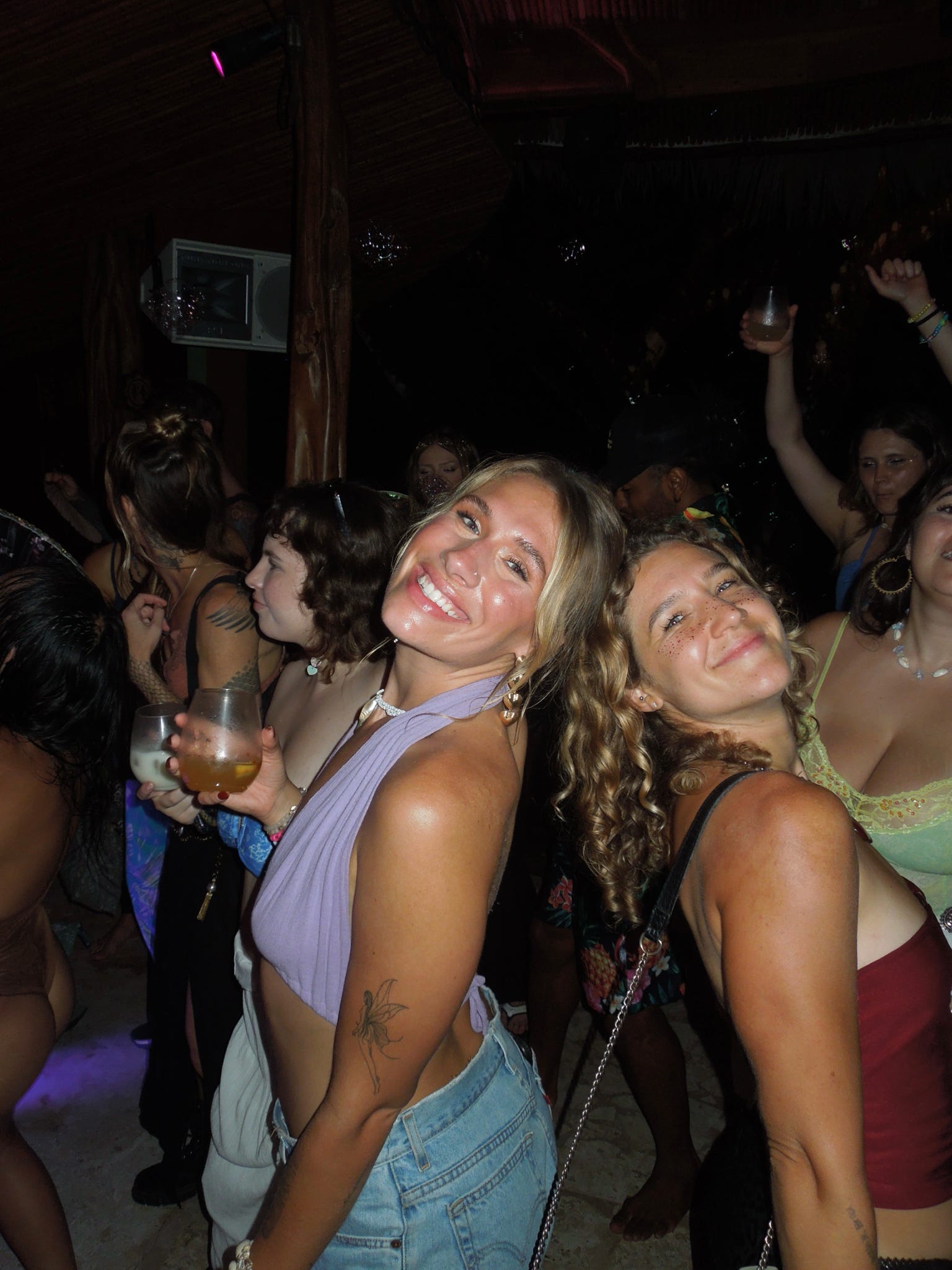 Two friends laughing on the dancefloor