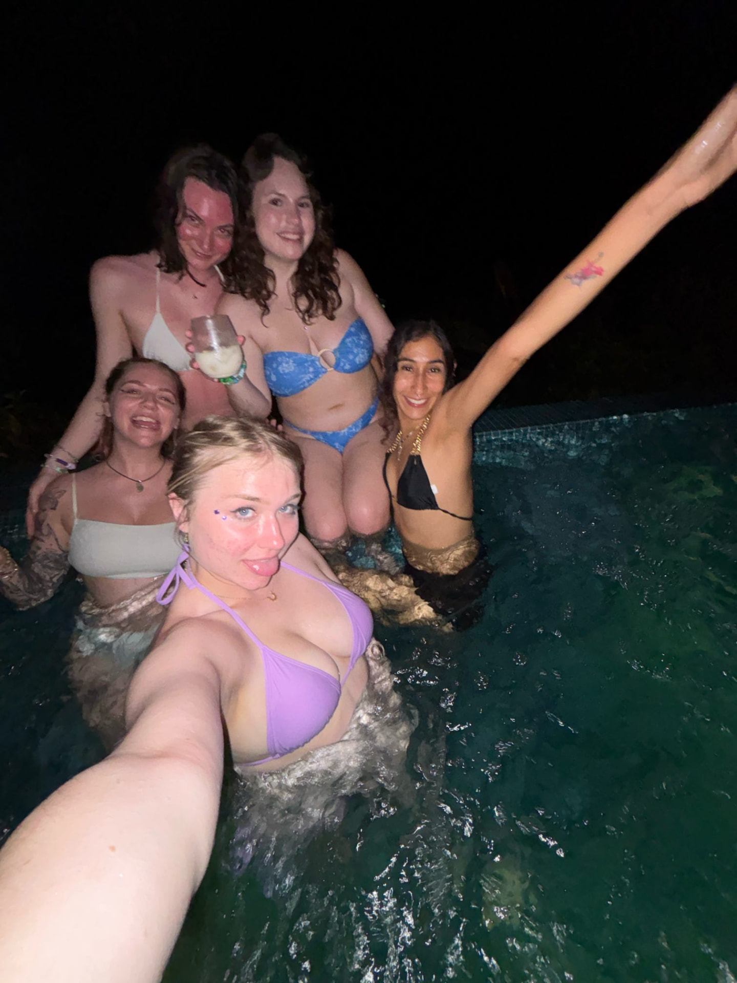Late-night pool selfie with the crew