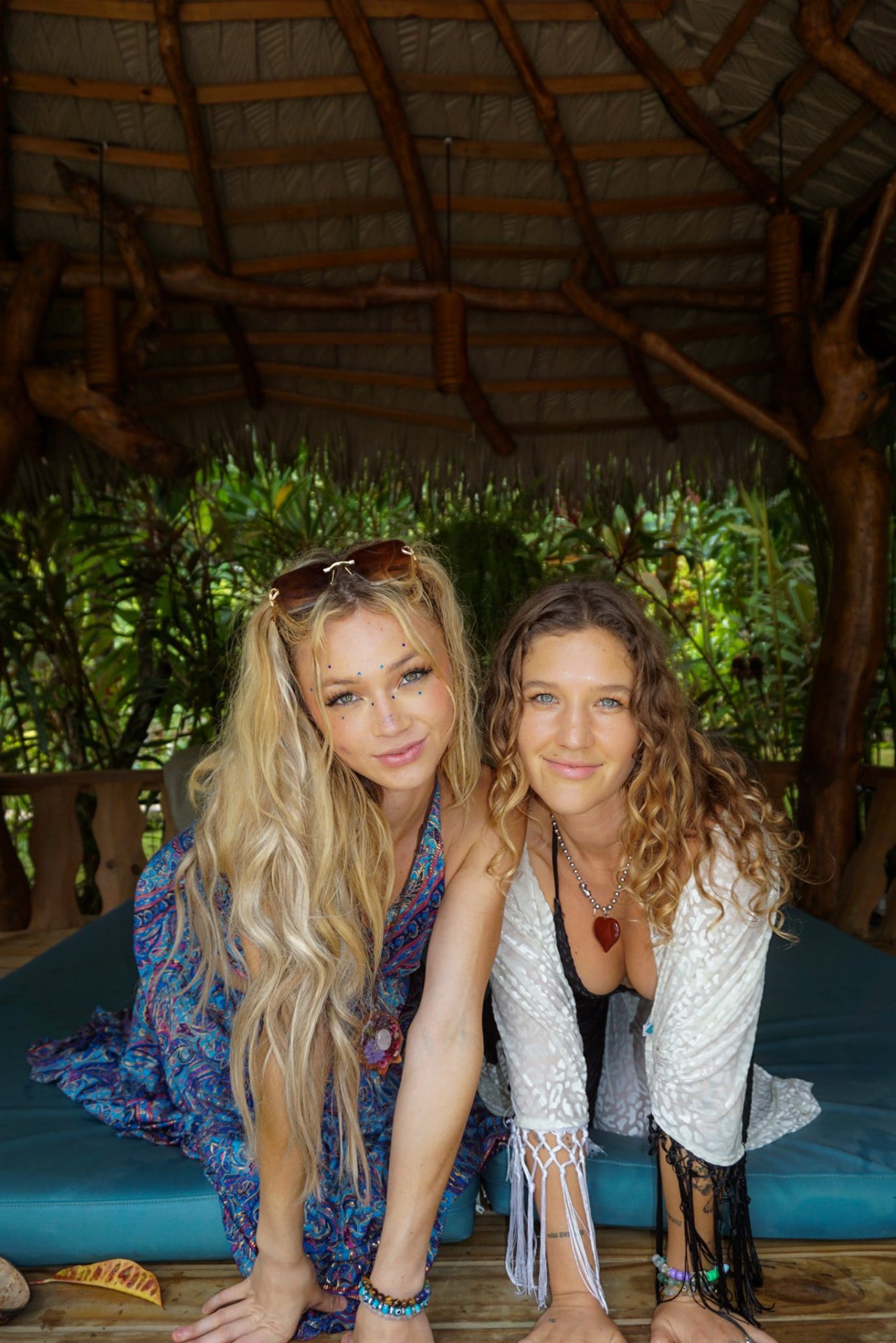 Two friends on the daybed under the palapa