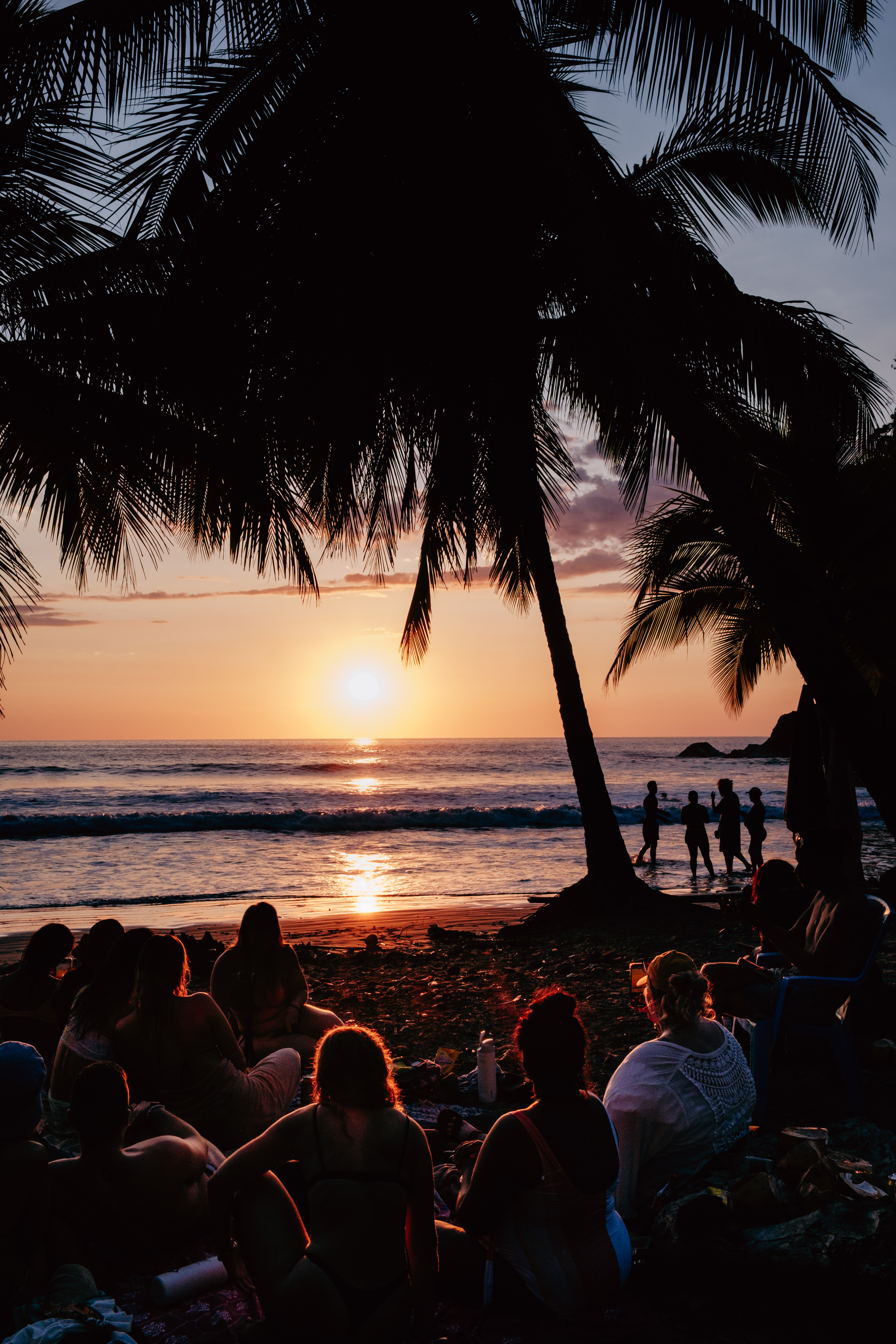 Sun dropping into the ocean on the beach at Uvita