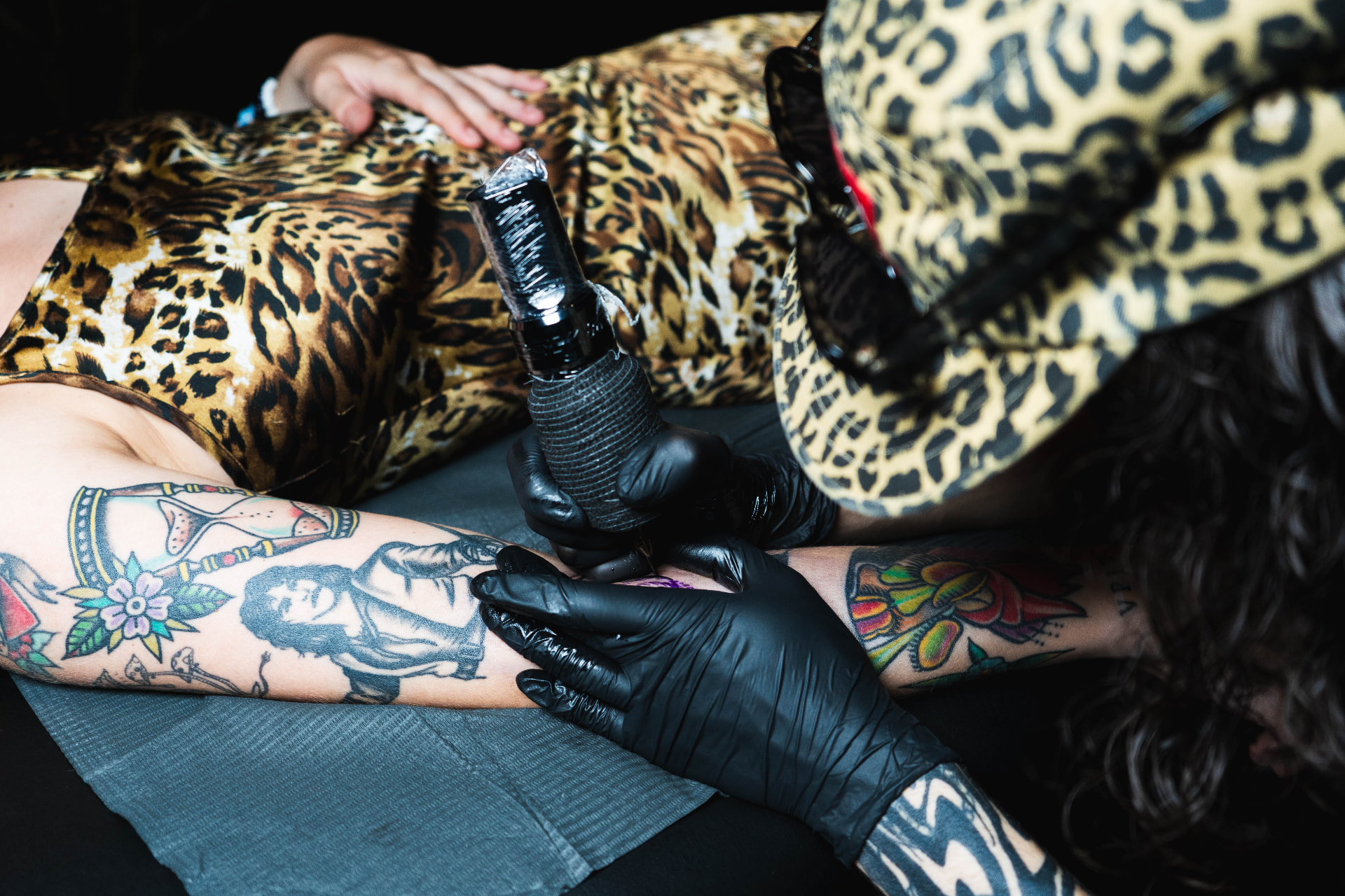 Close-up of a tattoo being done at the retreat